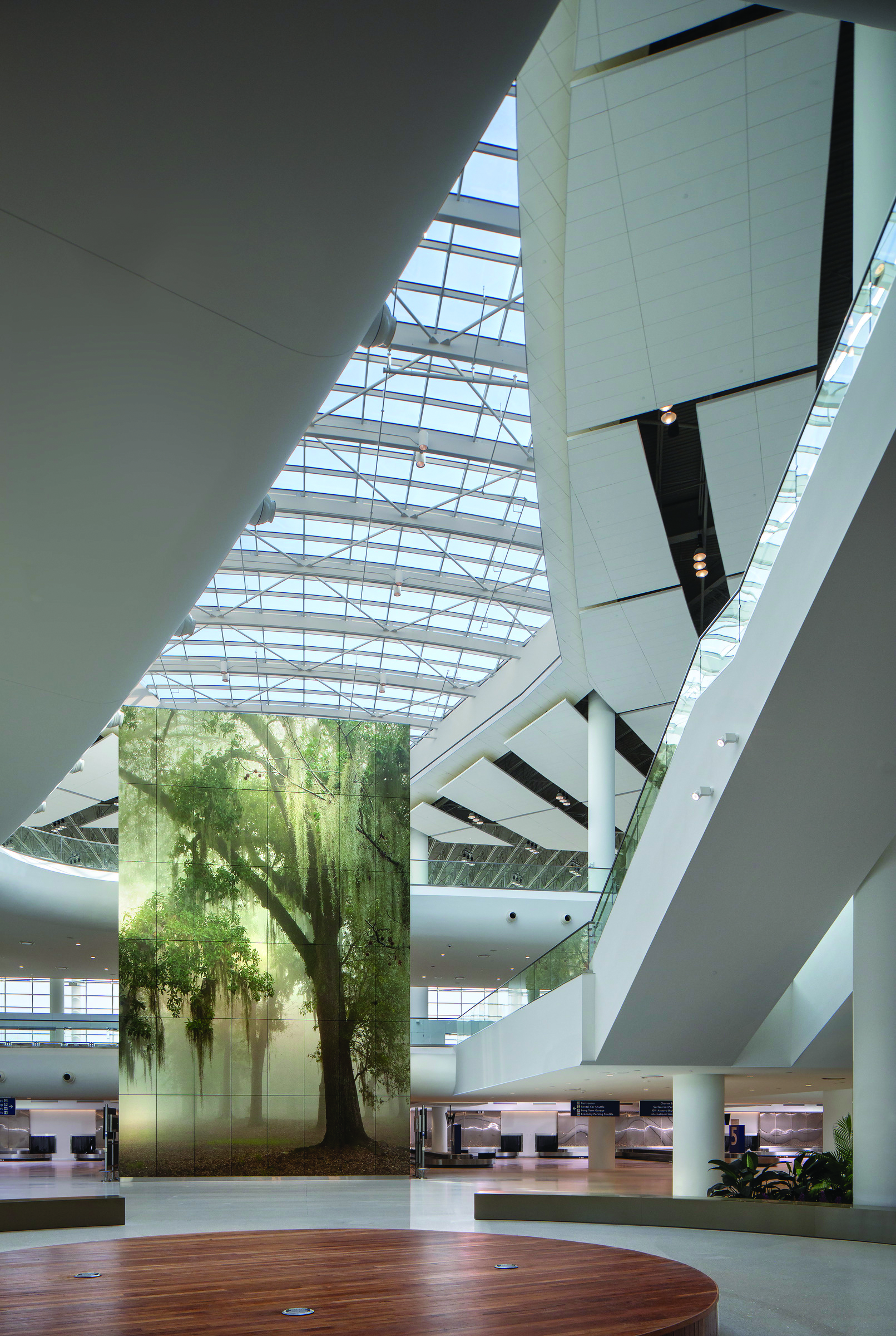 photo of the new terminal at the Louis Armstrong New Orleans International Airport showing its artwork, geometric angles, and skylight roof