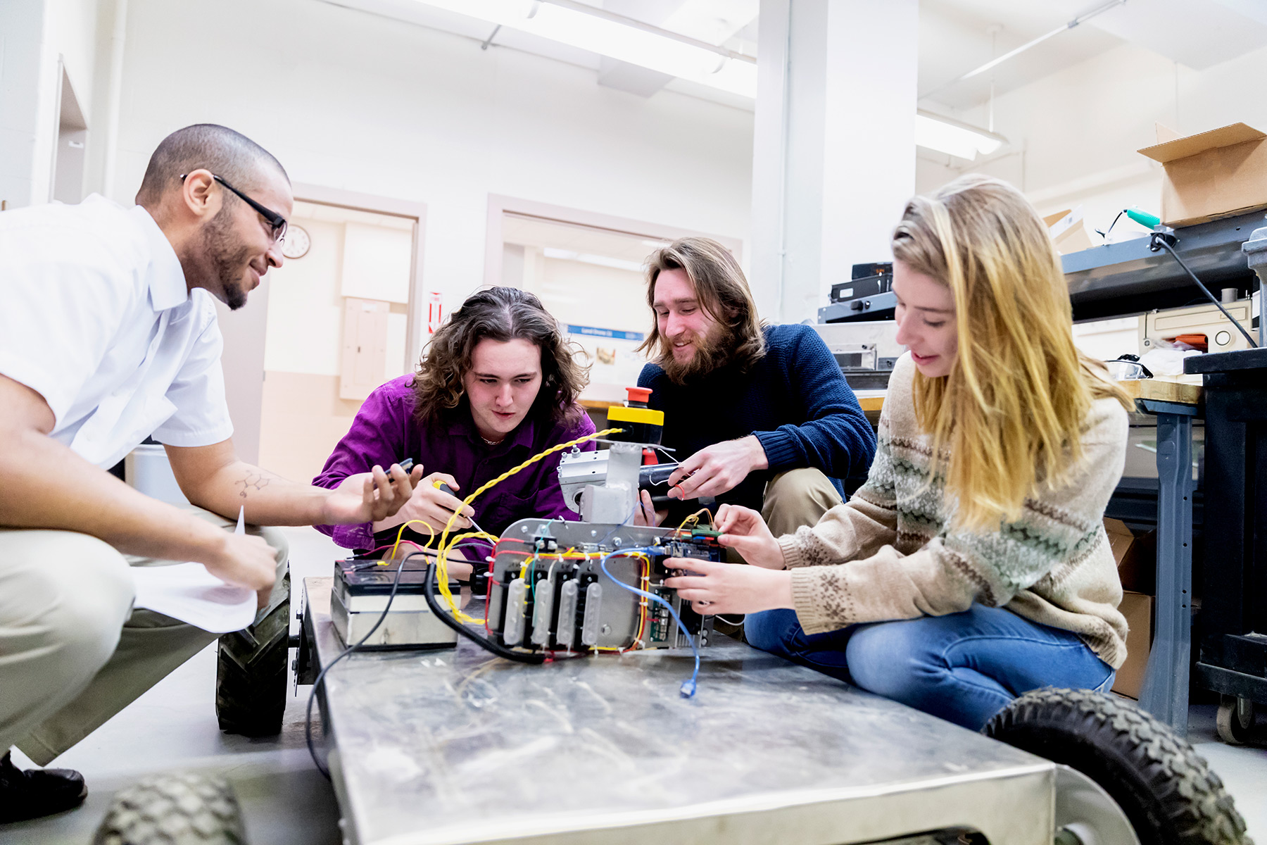 An ASCE Younger Member collaborating with civil engineering students.