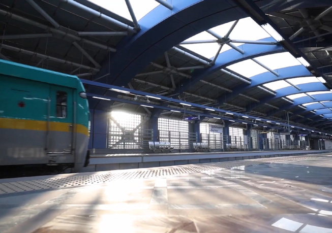 Train platform at Cairo Metro Line 3 Phase 3, featuring a modern station canopy and rail infrastructure.