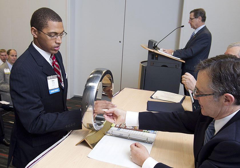 Sam Oke receives Order of the Engineer ring from President DiLoreto.