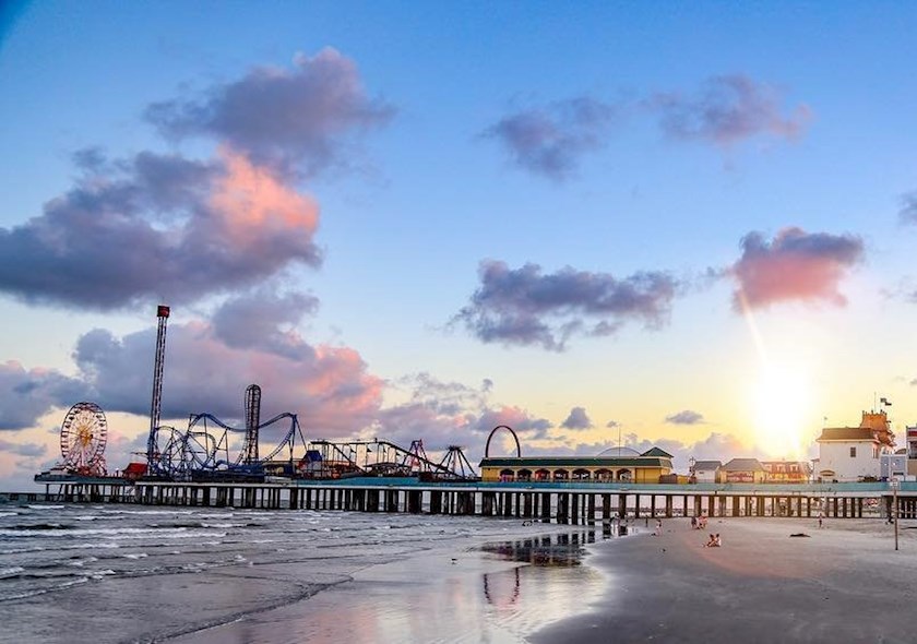 Galveston beach and boardwalk at sunset