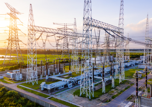 substation towers in green field