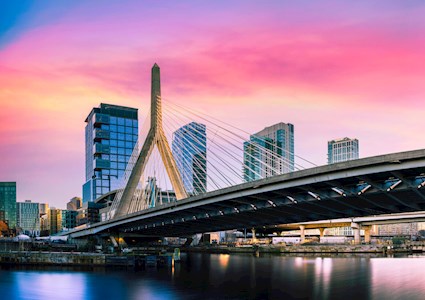 Zakim Bridge and Boston City Skyline over the Charles River at Sunset in Boston, Massachusetts, a beautiful vibrant modern cityscape of New England of America