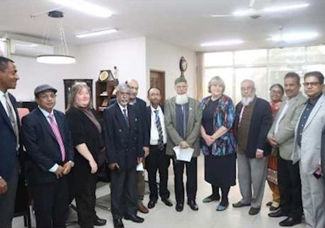ASCE and IEB leaders met to sign agreement of cooperation. Pictured are 13 people in a room in Dhaka. 