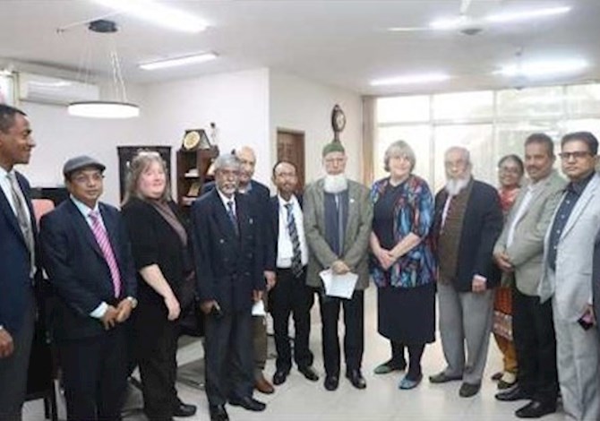 ASCE and IEB leaders met to sign agreement of cooperation. Pictured are 13 people in a room in Dhaka.
