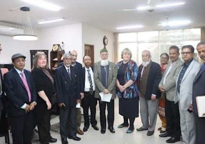 ASCE and IEB leaders met to sign agreement of cooperation. Pictured are 13 people in a room in Dhaka. 