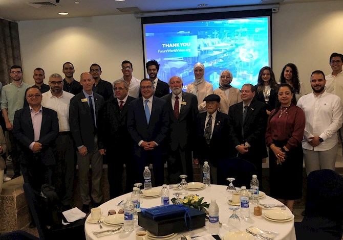 Meet the ASCE President at American University in Cairo Student Chapters event. Pictured are 25 people standing in a meeting room at American University in Cairo. 