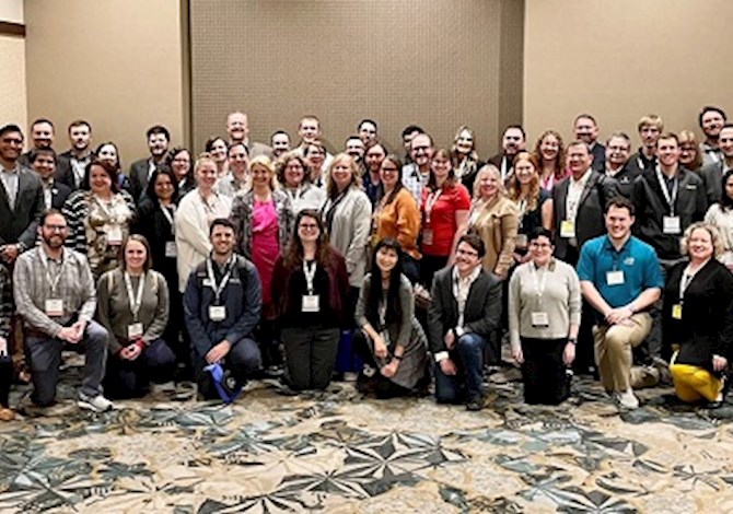2023 MRLC Regions 3,6,7 Denver, Colorado group photo. Pictured 63 people facing the camera smiling in a hallway. 