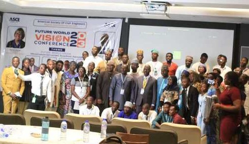 Group photo with 45 people in front of the room. 