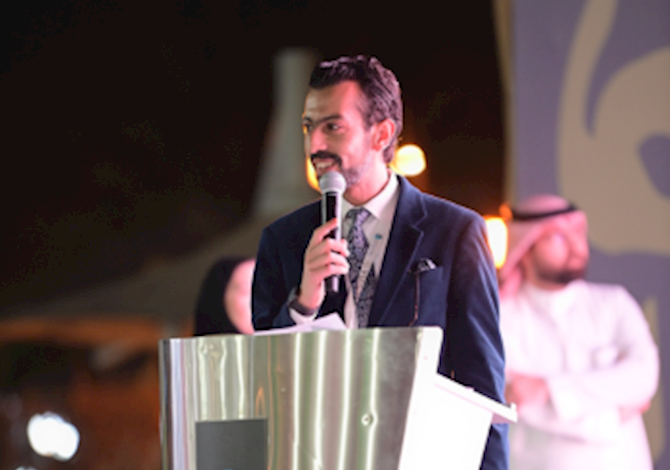 One person standing at a podium giving a speech.