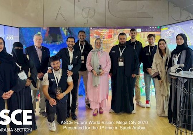 Twelve people facing the camera and smiling.