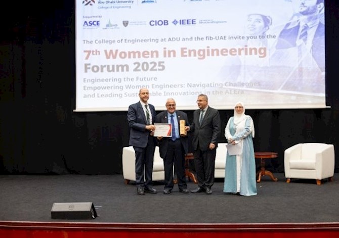 Dr. Elias Sayah receiving an appreciation certificate