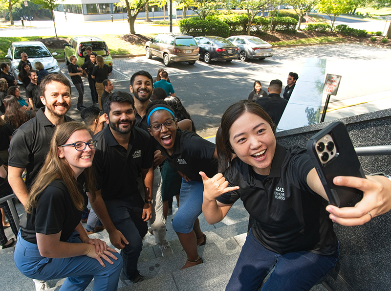 group of younger members taking a photo together.