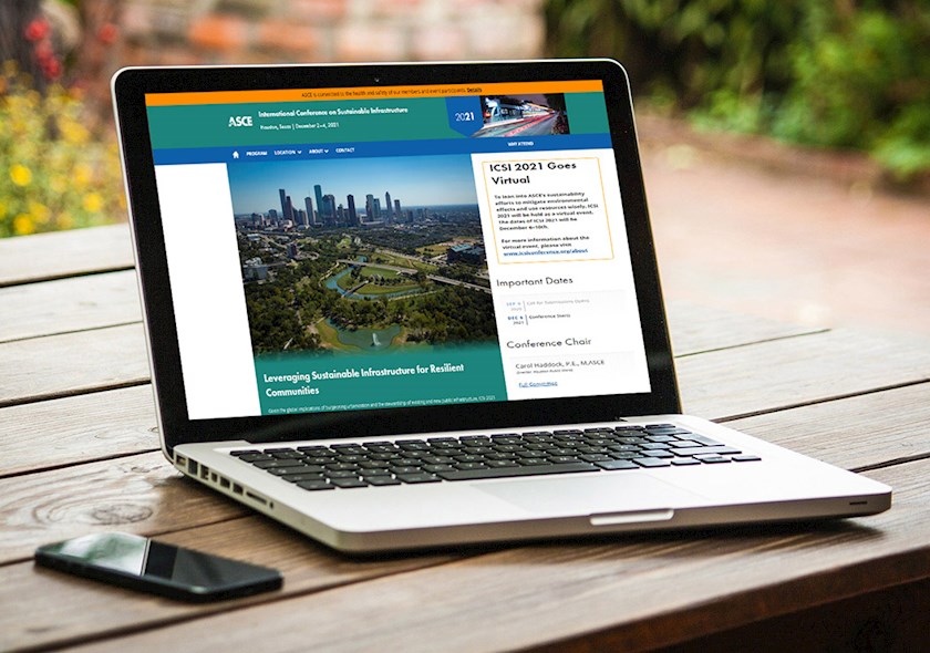 Hero image of ICSI 2021 - a laptop displaying the conference website
