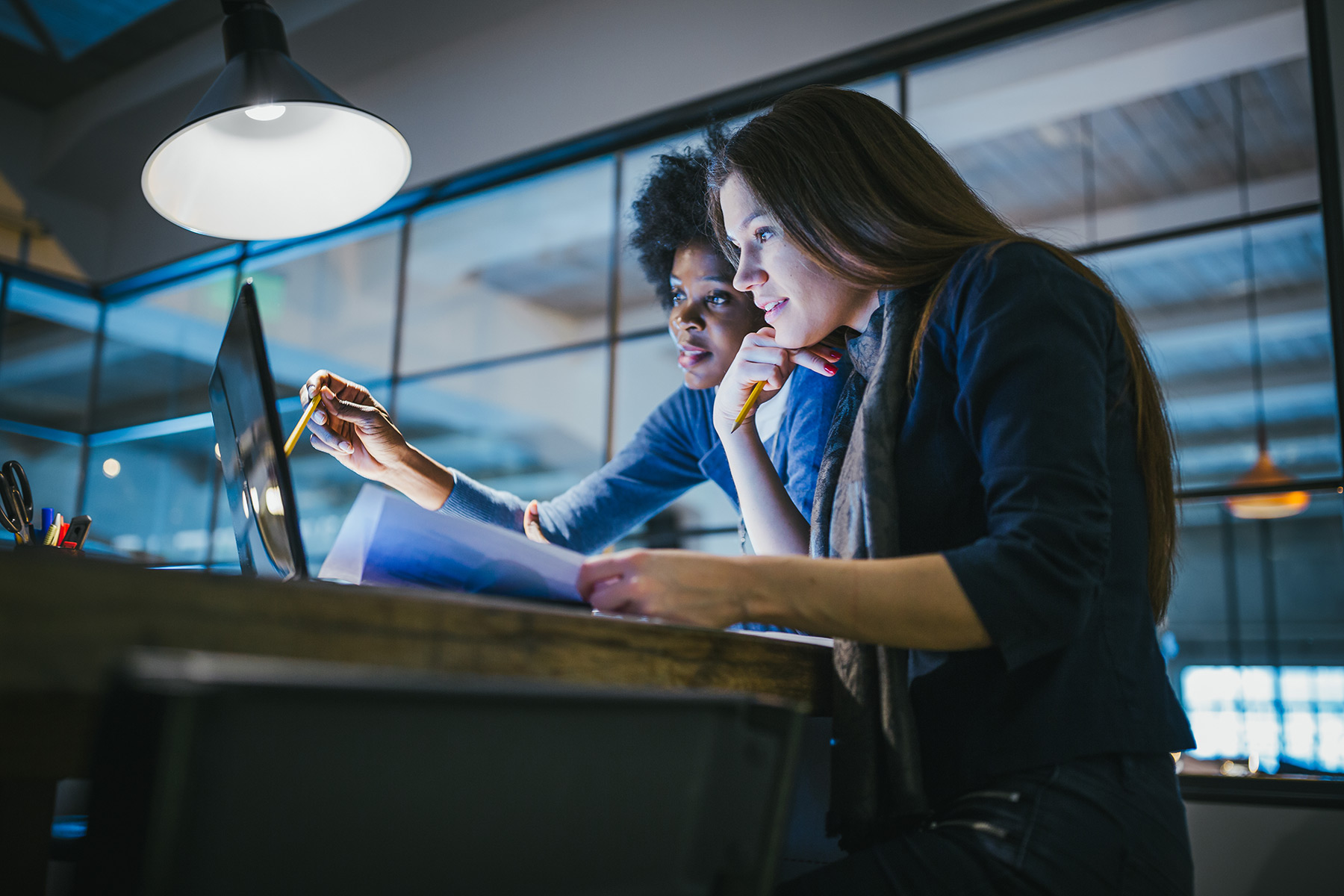 Two women in discussion, office environment