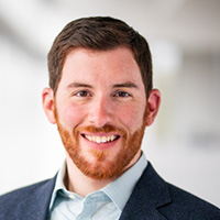 Man smiles at the camera.