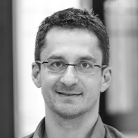 man in shirt wearing glasses