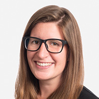 The author is a young woman with long hair and glasses. 