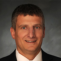 man smiles at camera