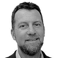 Man in white shirt and dark suit. 