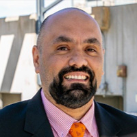 Man smiles at the camera.