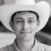 Man in cowboy hat and button-down shirt