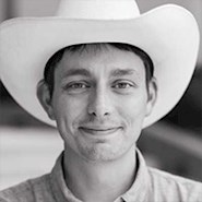 Man in cowboy hat and button-down shirt