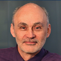 Man in dark suit jacket and shirt