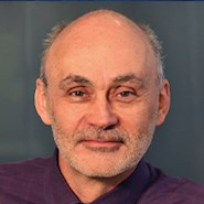 Man in dark suit jacket and shirt