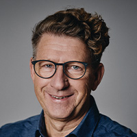 Man smiles at the camera