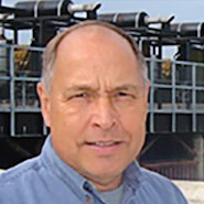 Man smiles at camera.