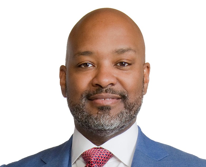 man wearing a light blue suit with a patterned tie