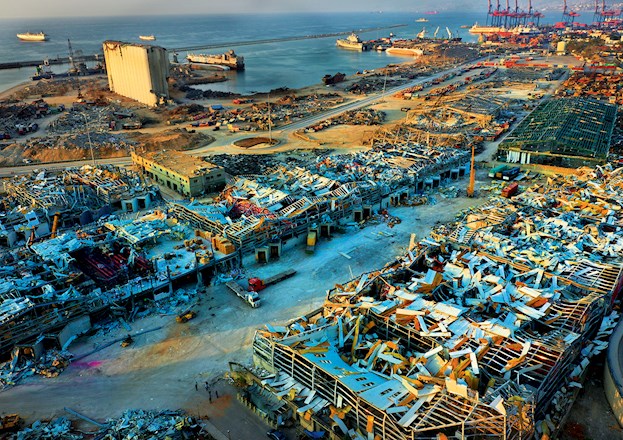 destroyed and roofless buildings after a fire and subsequent explosion