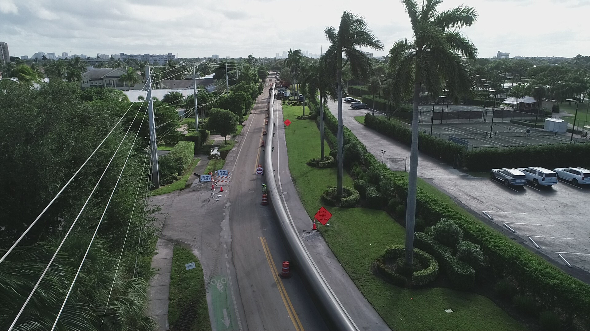 a force main extends along the top of a roadway in the city of Fort Lauderdale