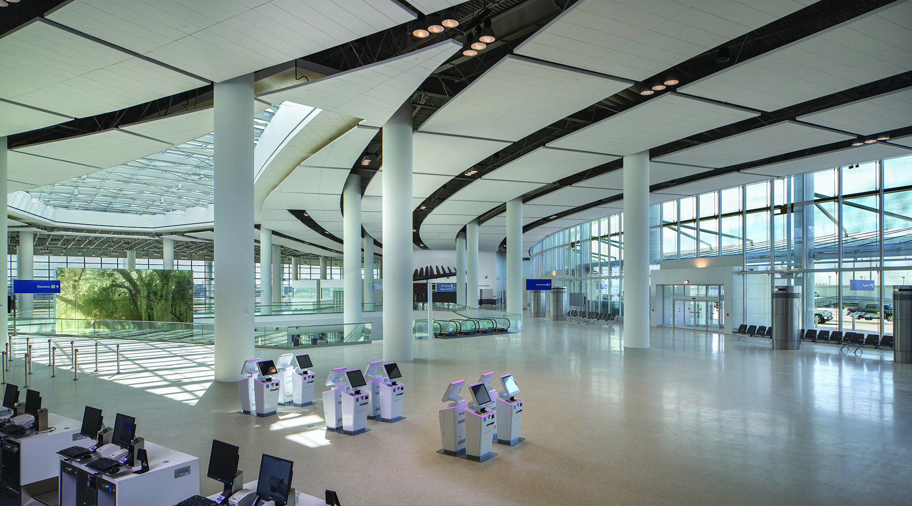 photo of the new terminal of the Louis Armstrong New Orleans International Airport showing ticket counters and the check-in area