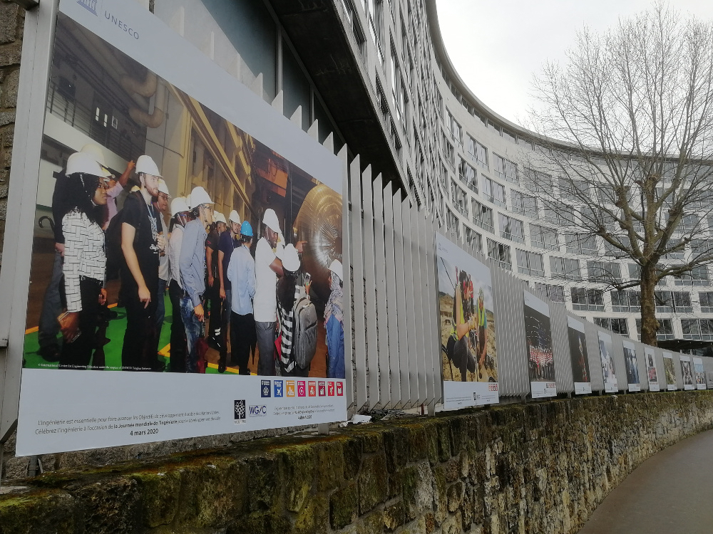 a poster promoting 2020 World Engineering Day for Sustainable Development is displayed on an exterior wall