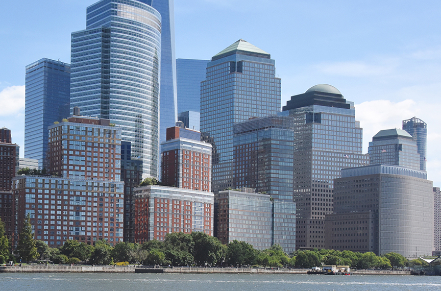 looking across the water at a cityscape that comes to the water's edge