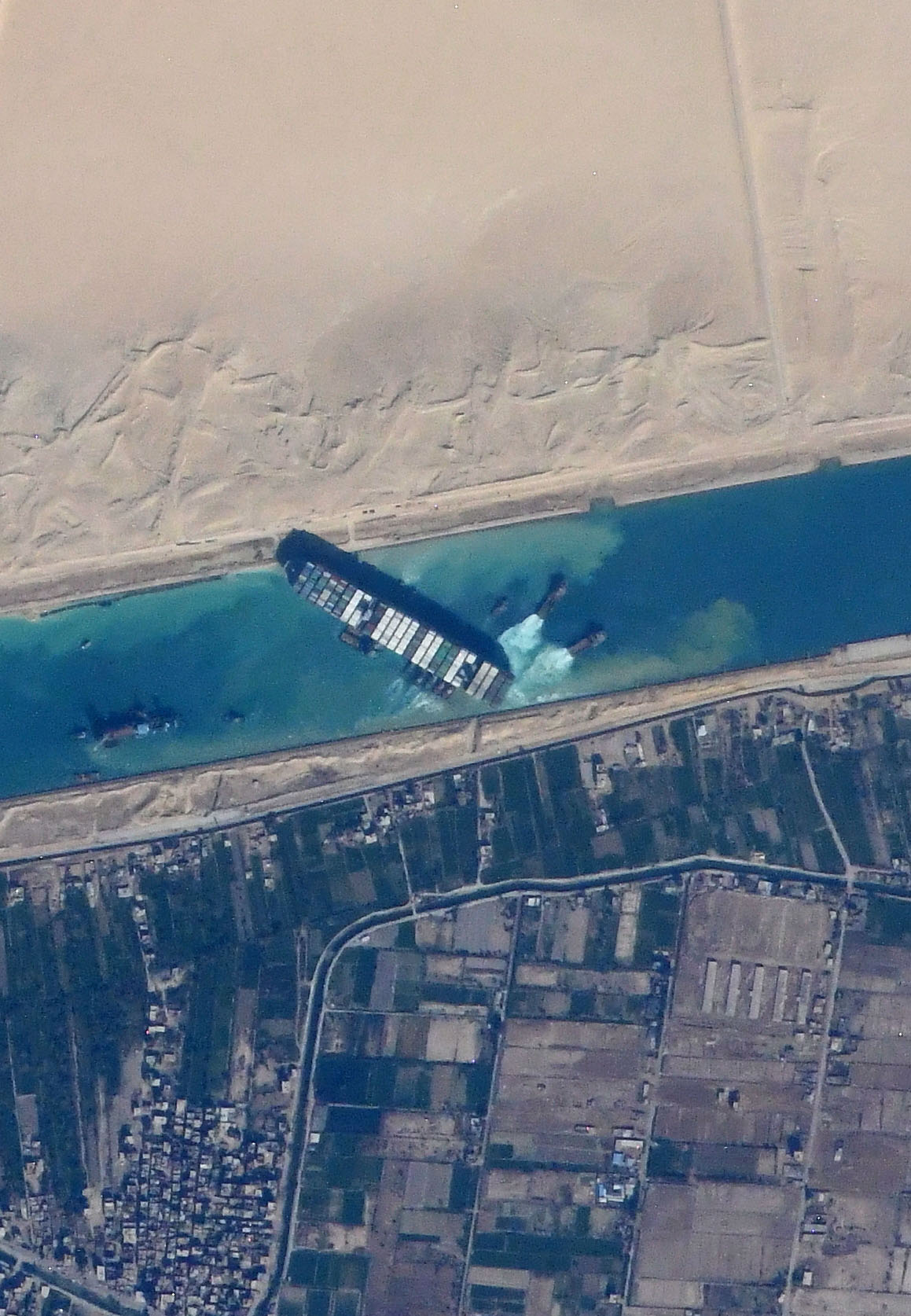 ship blocking a canal, viewed from above