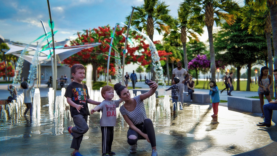 WOMAN AND CHILDREN IN FRONT OF FOUNTAIN