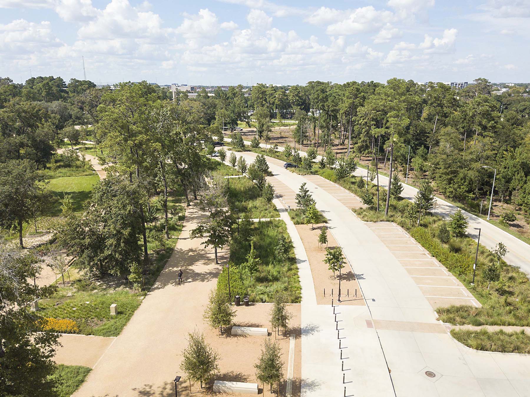 close up shot of walkways, green spaces, and trees at a national park