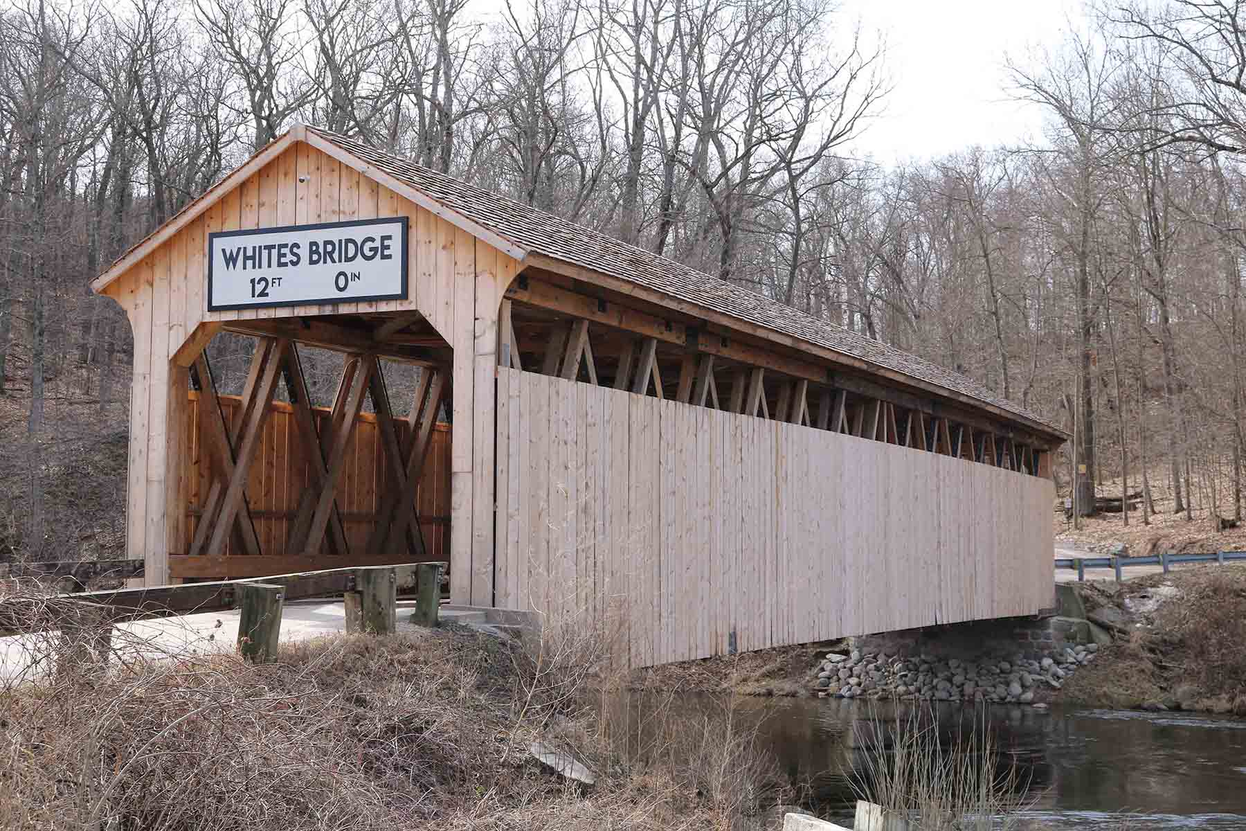 one lane wooden covered bridge