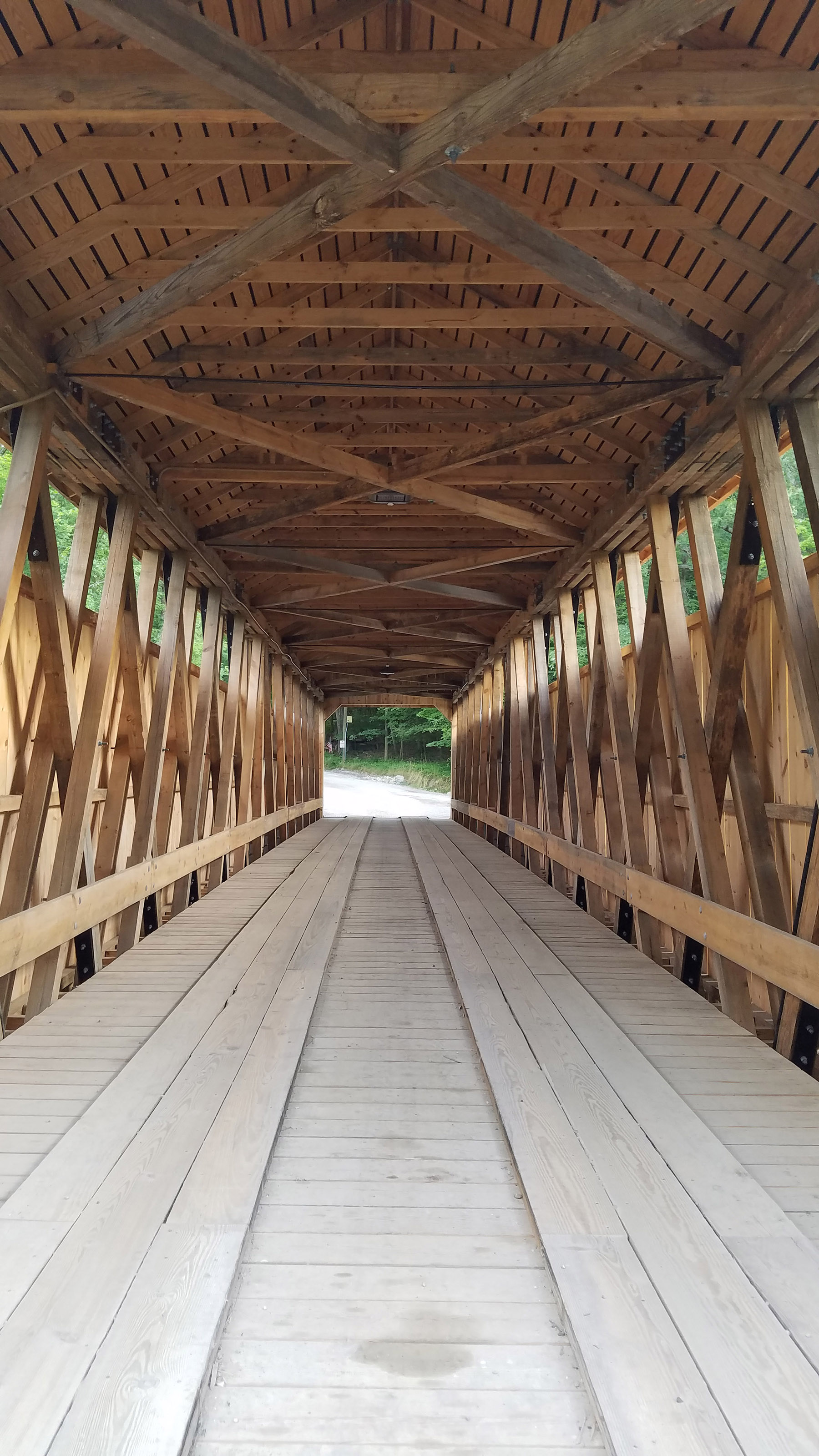 interior shot of new bridge showing the beams comprising the roof, sides, and the wheel path