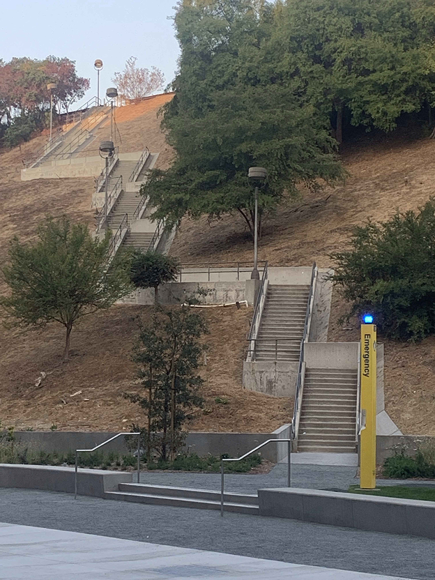 series of concrete staircases climb up a steep hill