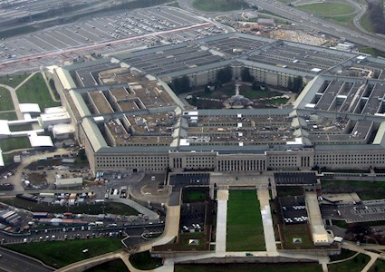 five-sided building on a large green space