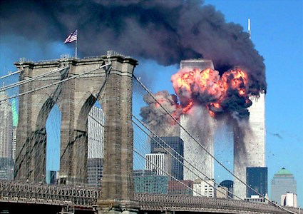 photo showing building on fire at moment of plane impact