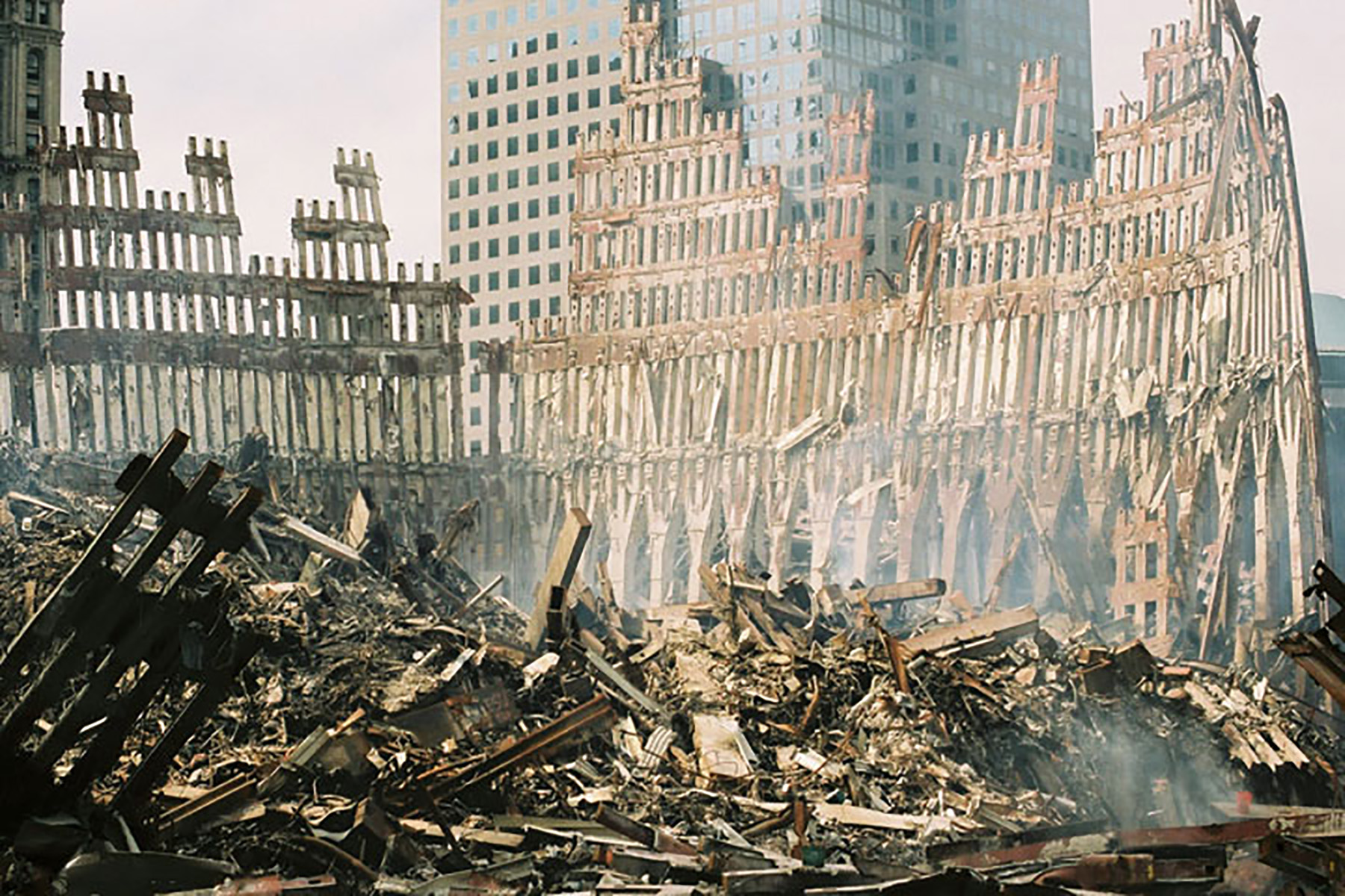 The remaining section of the World Trade Center is surrounded by a mountain of rubble following the September 11 terrorist attacks. 