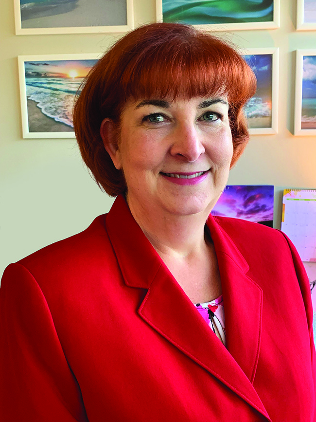 woman in red jacket smiling