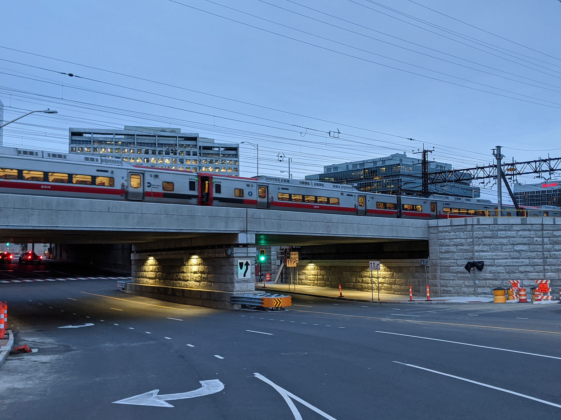 bridge overpass with railroad on top and road underneath