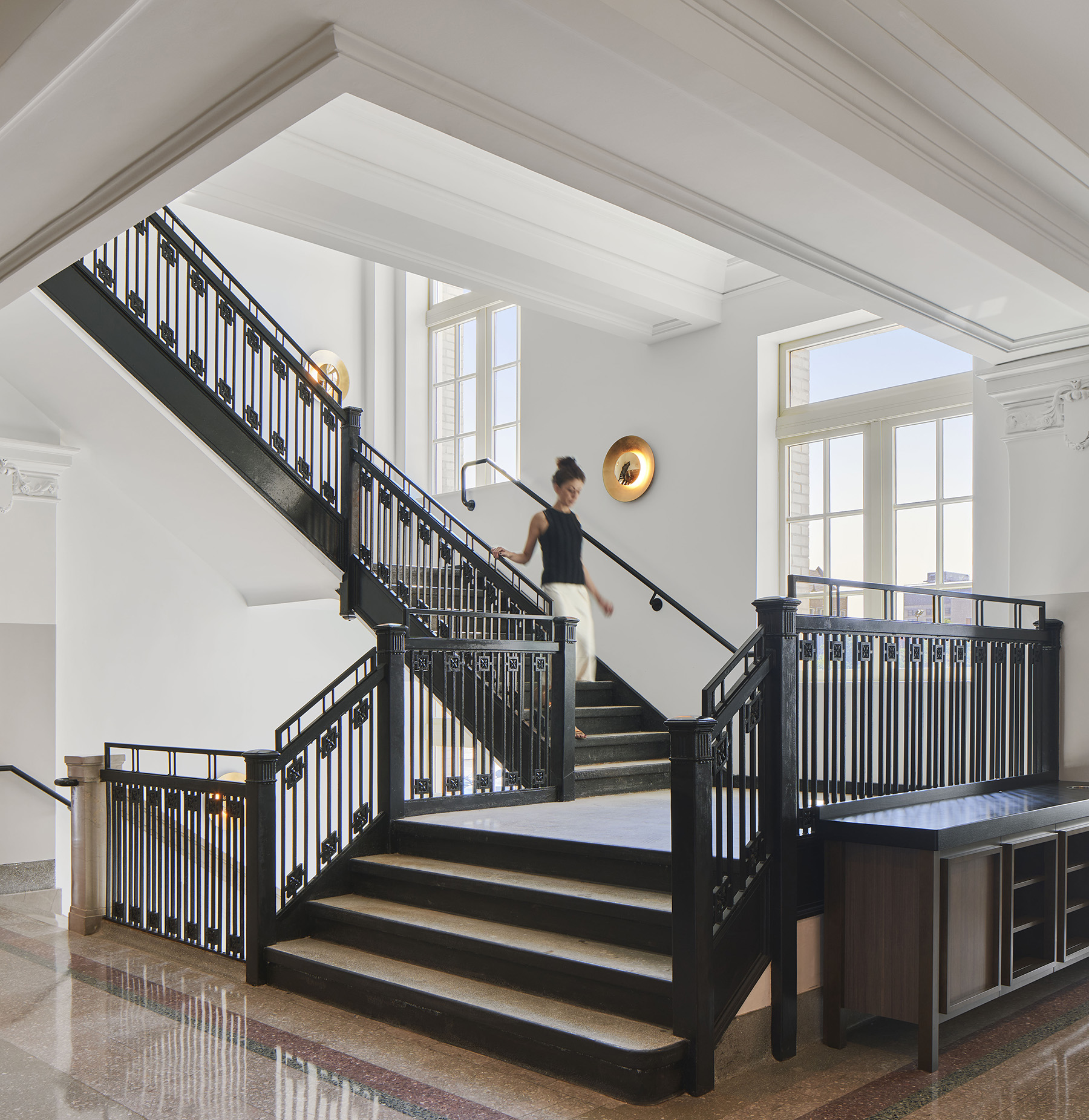 woman walking down stairwell