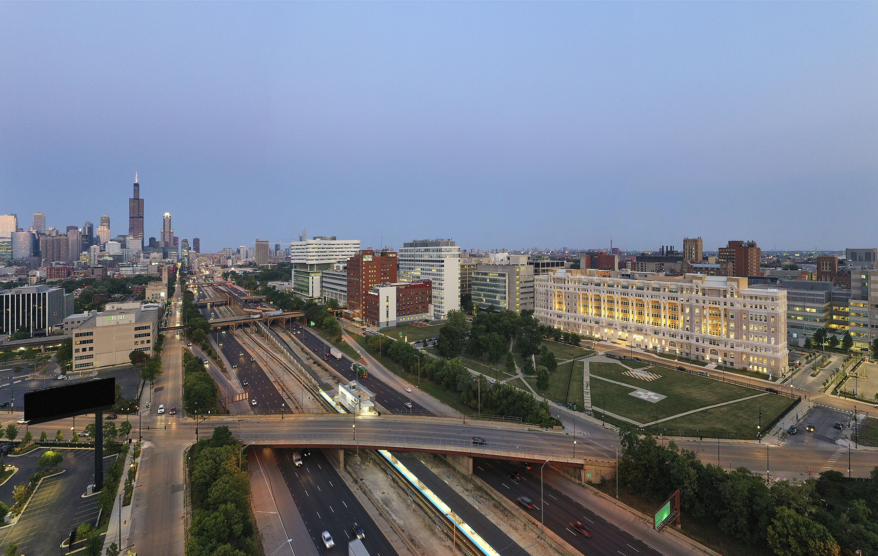 aerial view of cityscape, highway, and buildings